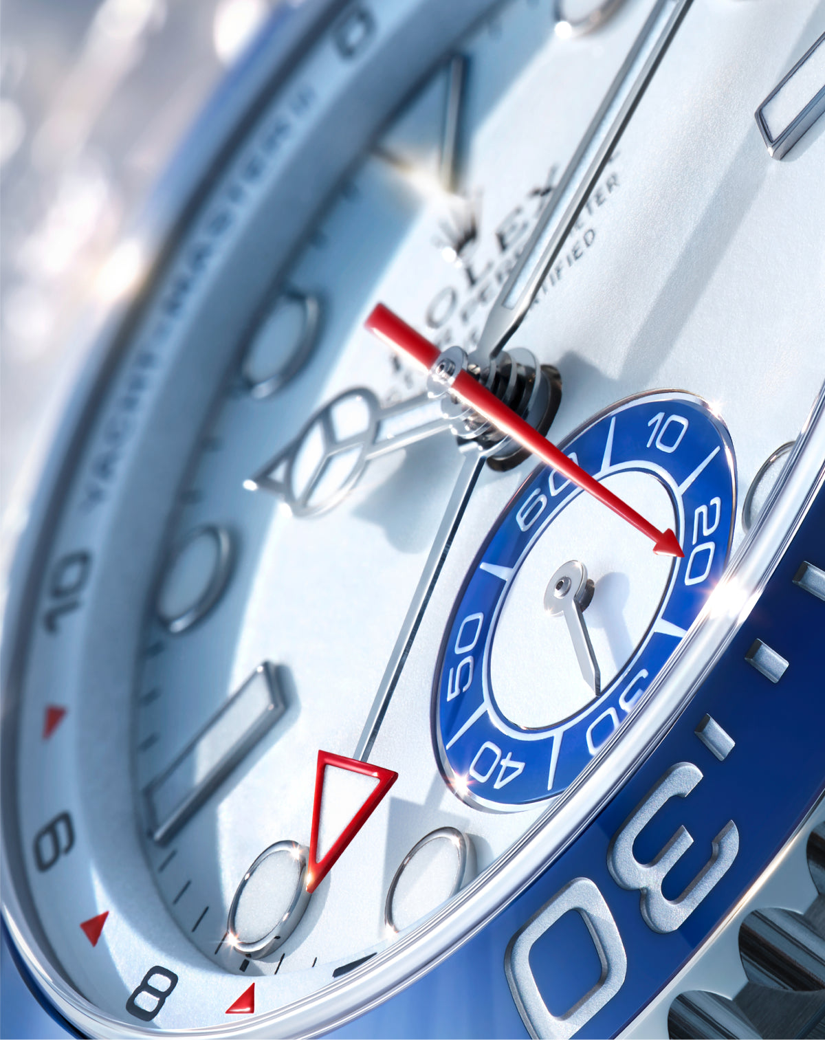 Close-up of a luxury watch face featuring a detailed second hand, blue subdial, and polished silver markers, highlighting fine craftsmanship and precision timekeeping.