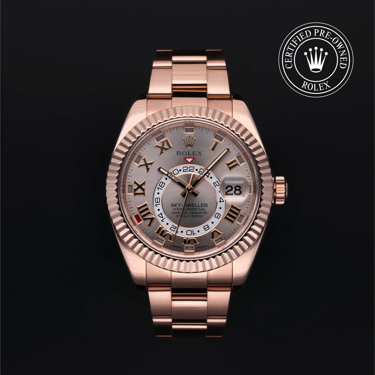 Rolex Sky-Dweller luxury watch in rose gold with Roman numerals and dual time display, offered by Henne Jewelers, family-owned luxury jeweler with customer service—Jewelers for Life.