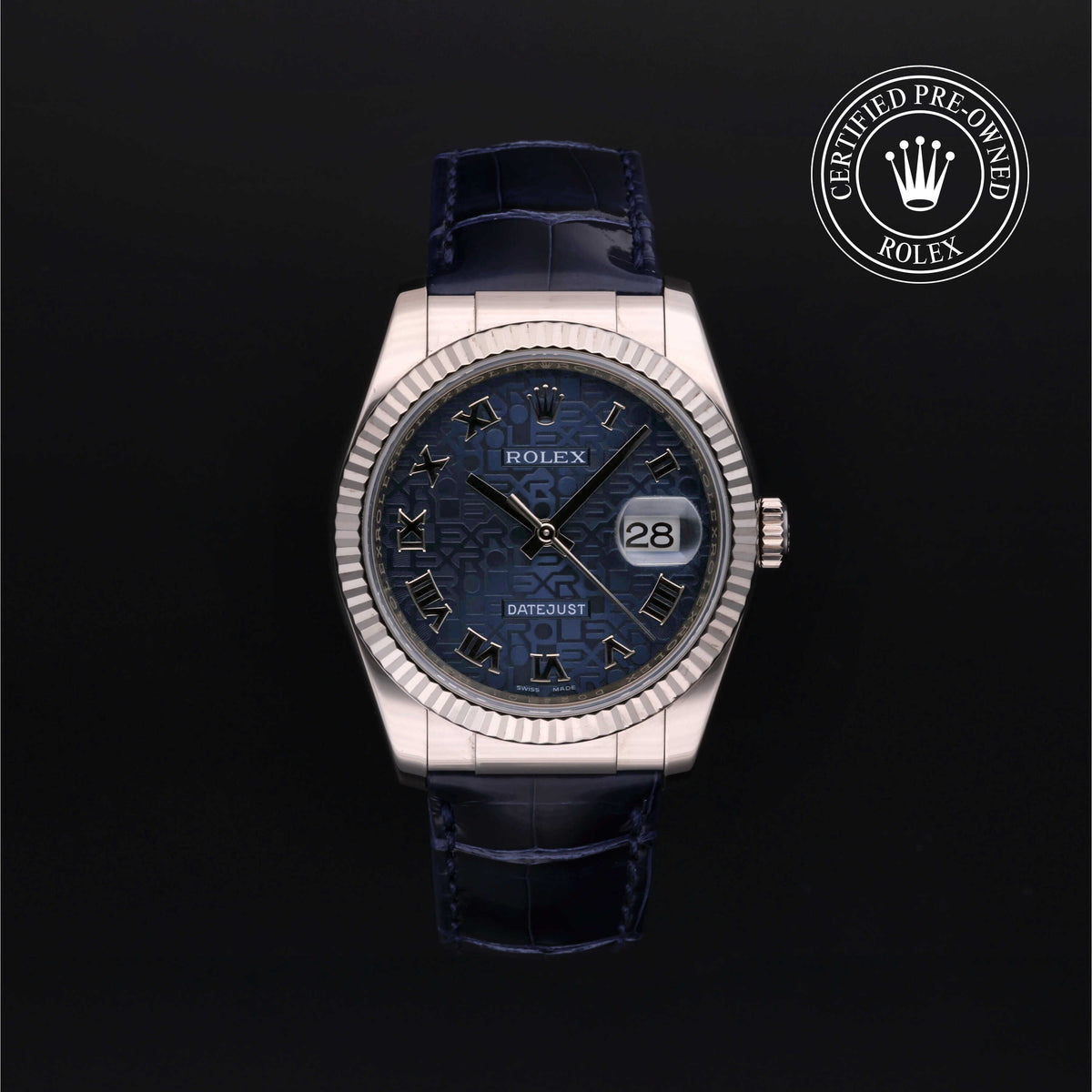 Rolex Datejust watch with a silver fluted bezel, blue patterned dial with Roman numerals, date window, and a dark blue leather strap, shown against a black background with a certified pre-owned Rolex logo.