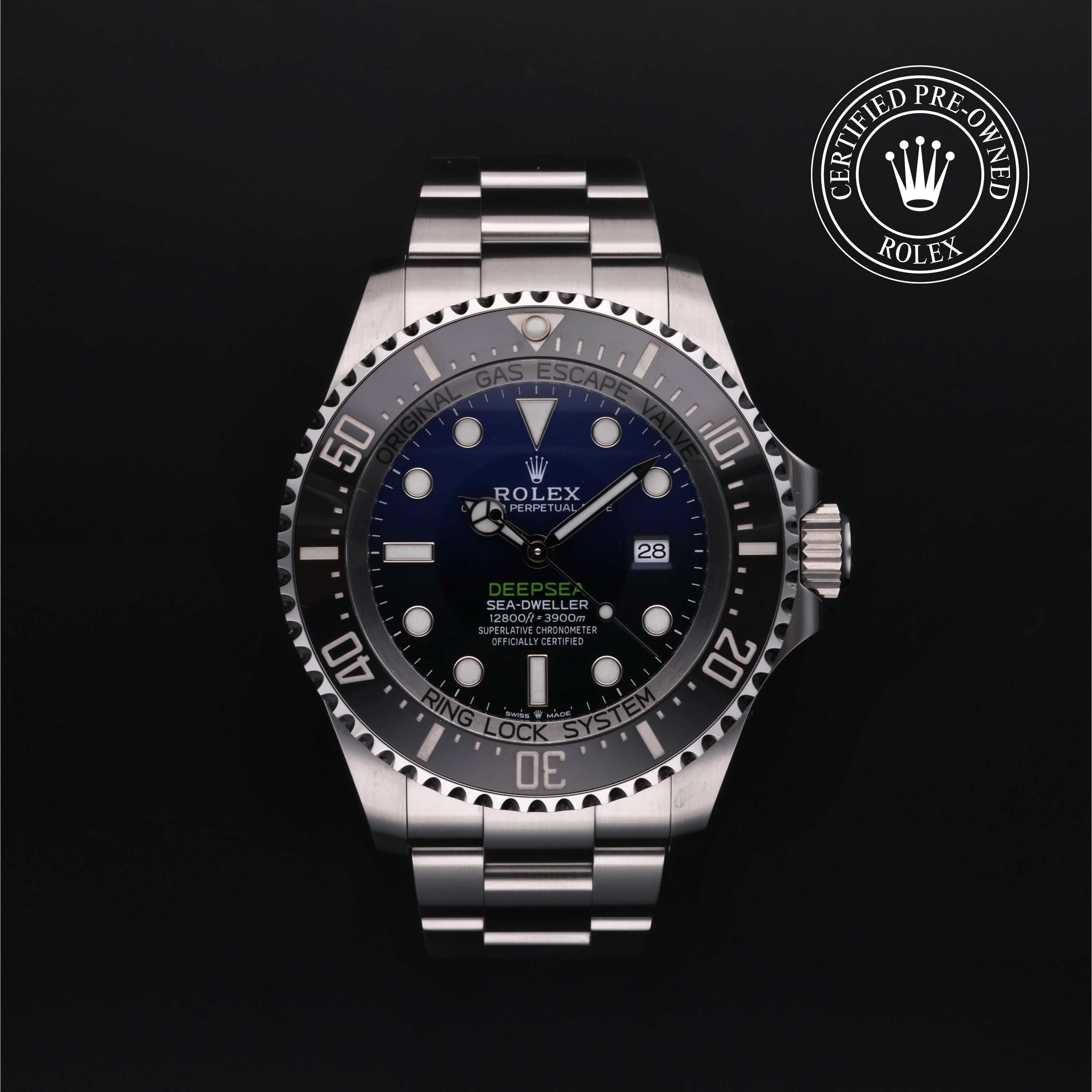 Rolex watch with blue dial on a black background, featuring the 'Certified Pre-Owned Rolex' logo.