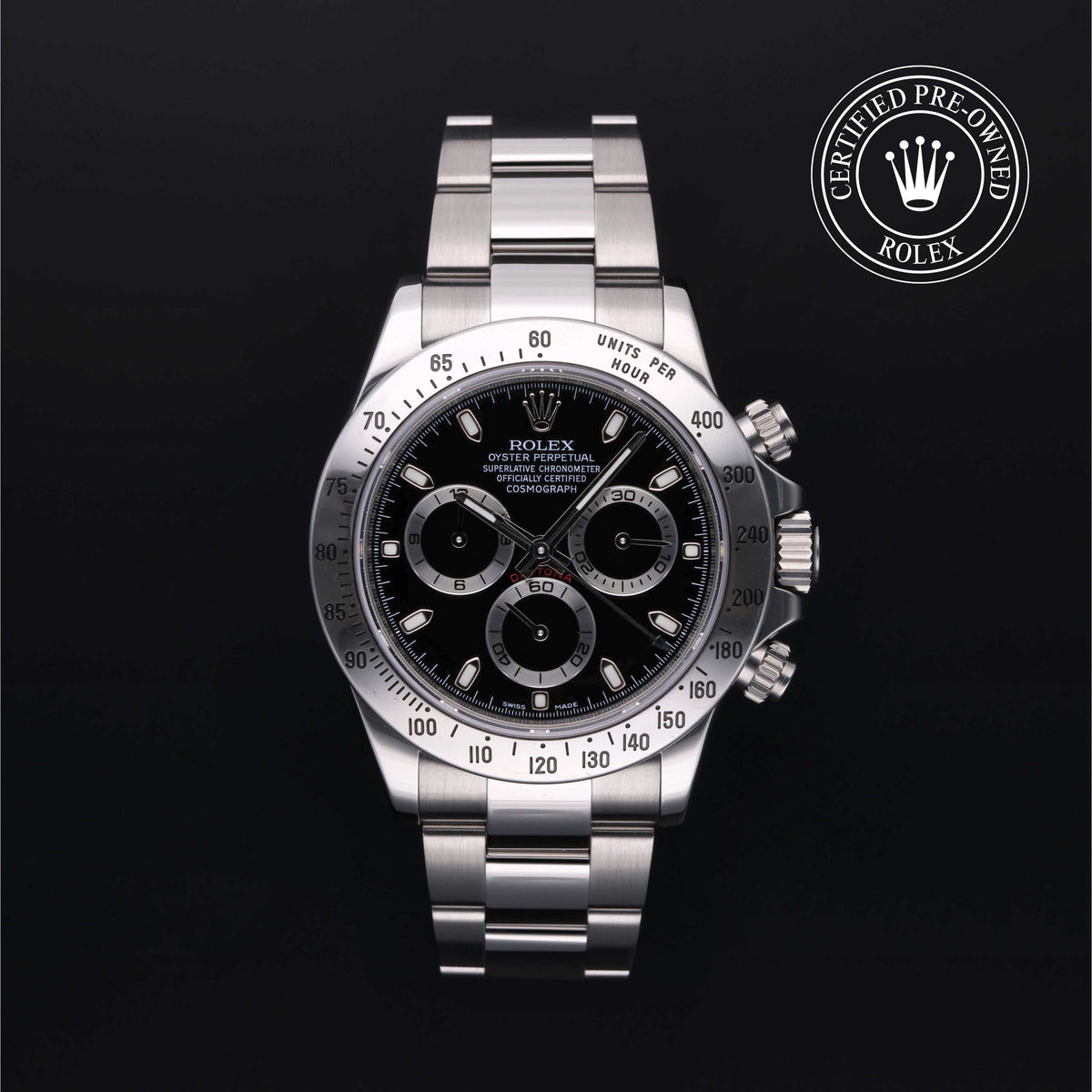 Close-up of a luxury stainless steel Rolex chronograph watch with a black dial and three subdials, featuring a certified pre-owned logo on a black background.