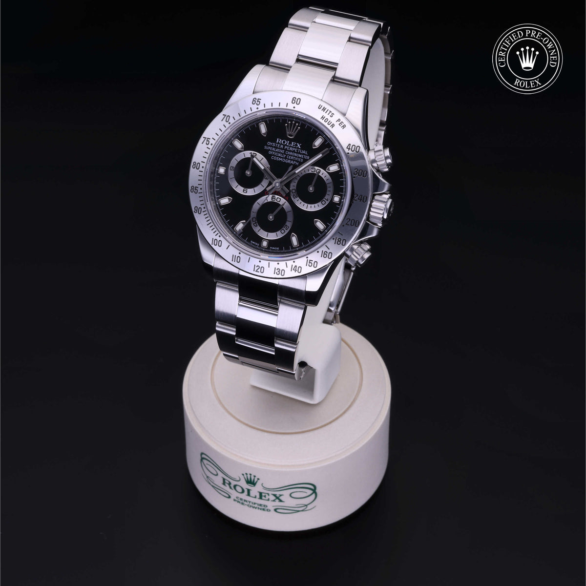 Rolex Certified Pre-Owned luxury watch with a black dial and stainless steel band displayed on a white stand, featuring the Rolex logo and certification badge.