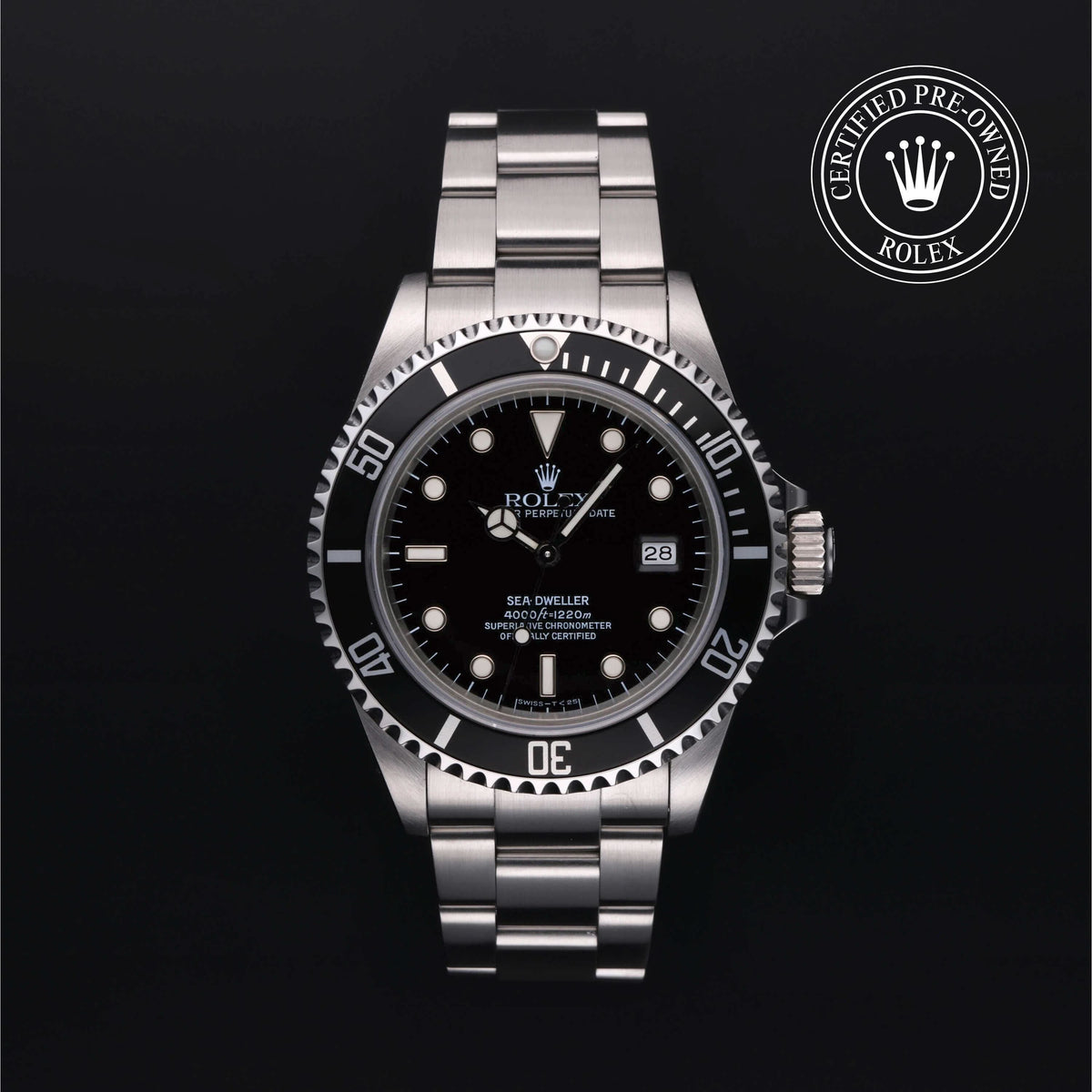 Rolex watch with black dial and silver bracelet on a dark background, featuring a Certified Pre-Owned Rolex logo.