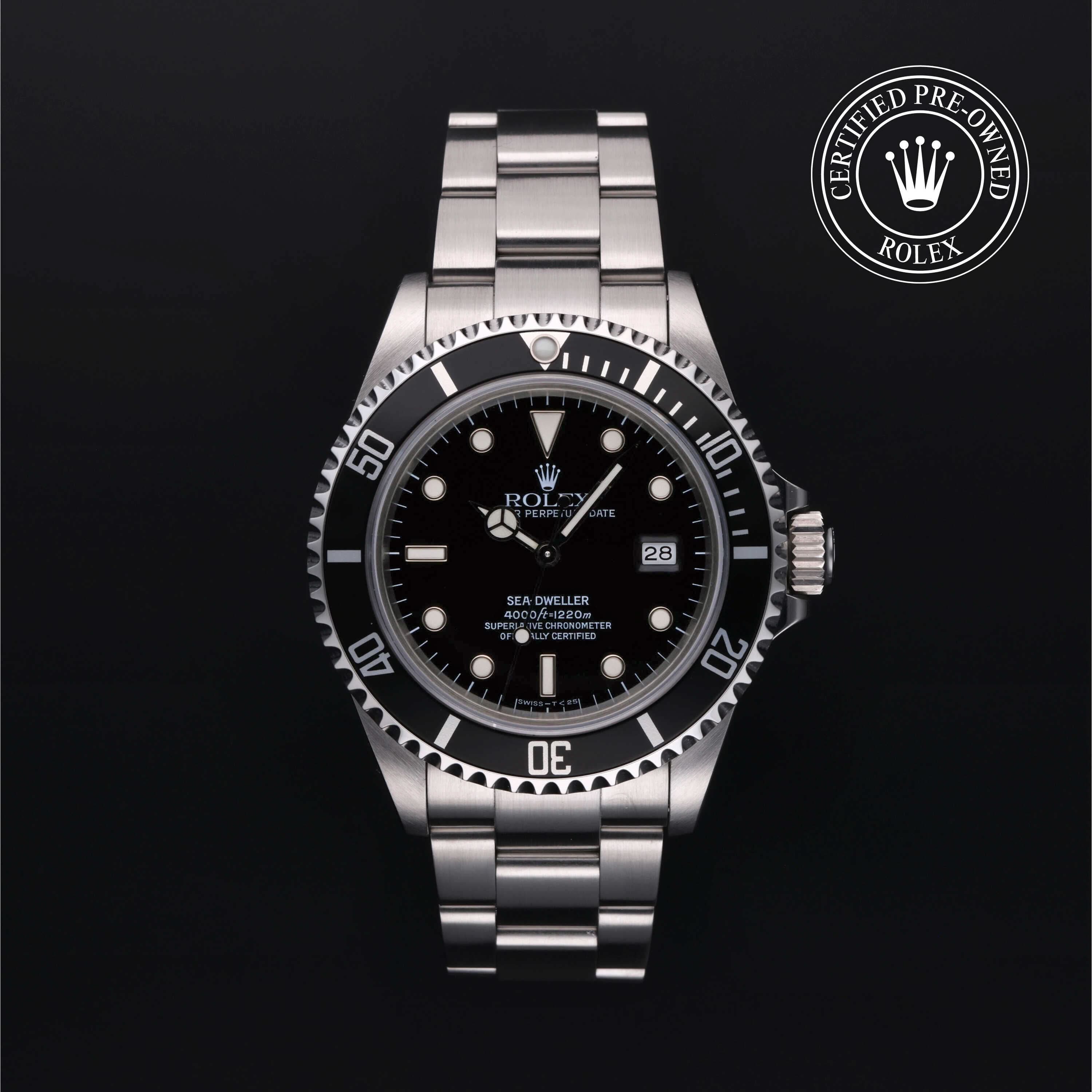 Rolex watch with black dial and silver bracelet on a dark background, featuring a Certified Pre-Owned Rolex logo.
