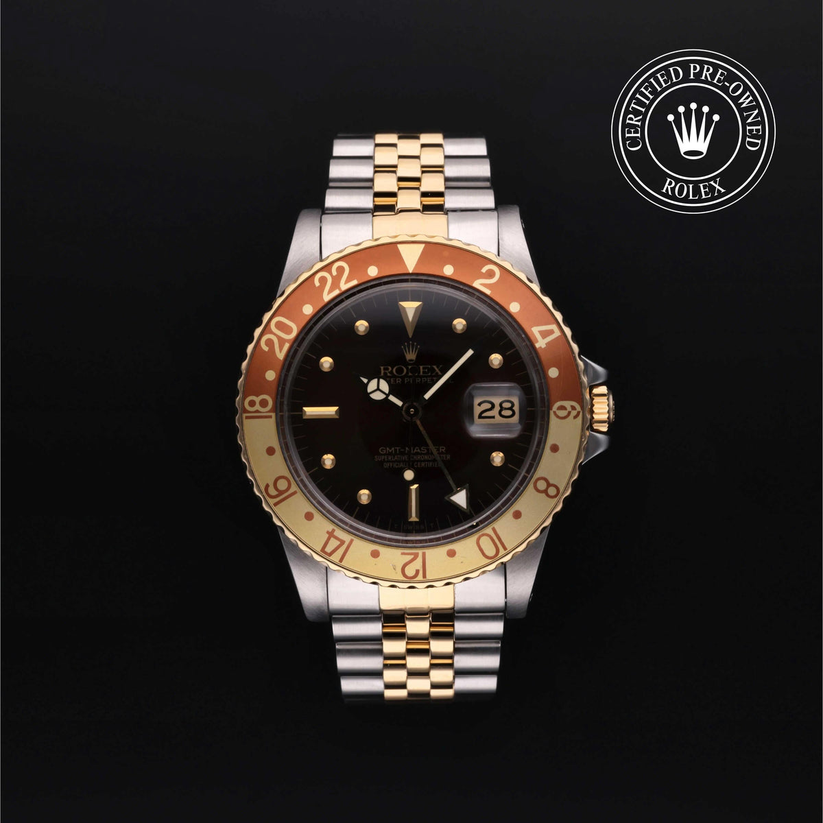 GMT-Master luxury watch with two-tone gold and stainless steel bracelet, black dial, and date display, offered by a family-owned jeweler known for exceptional customer service. Jewelers for Life.