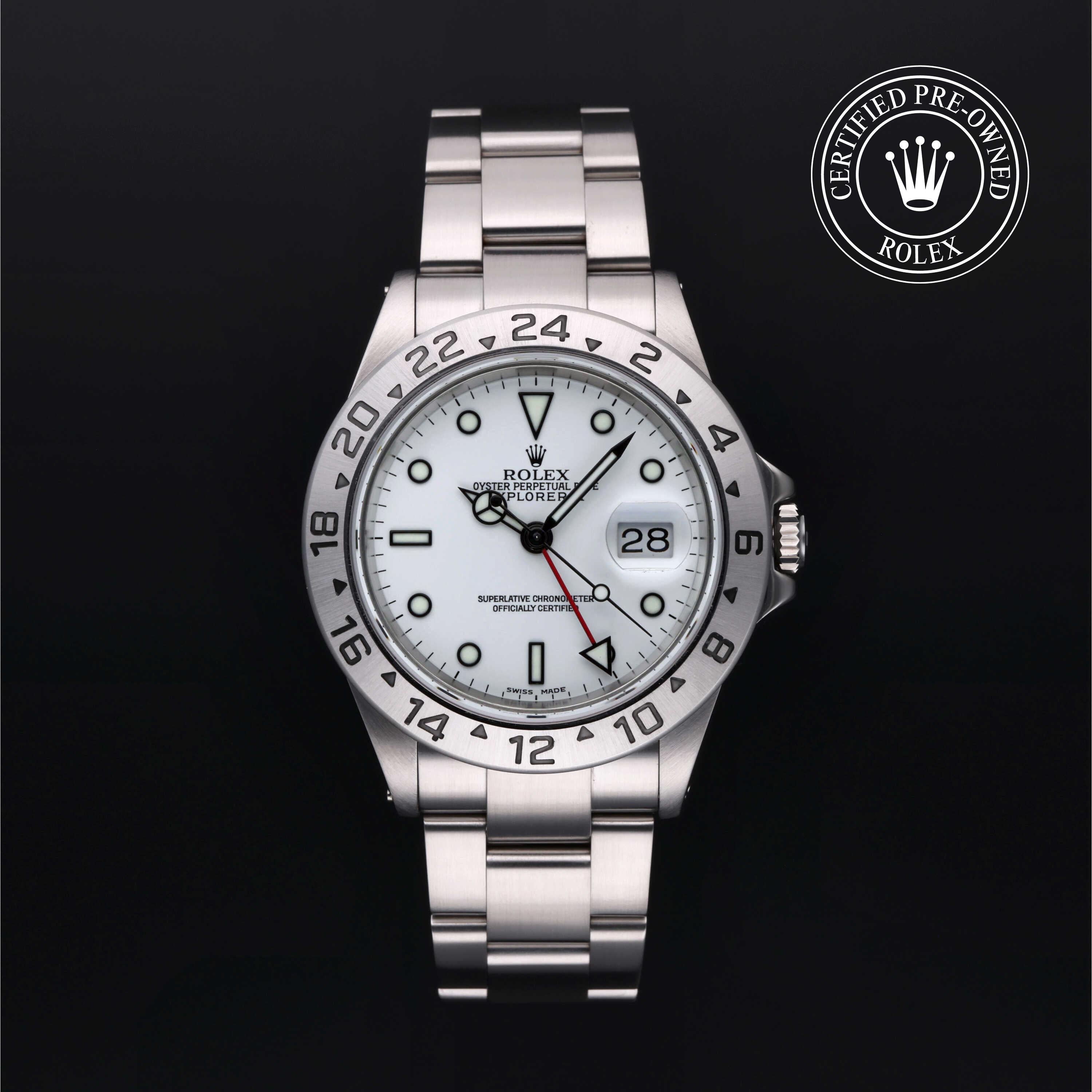 Rolex Explorer II luxury watch with white dial, stainless steel bracelet, date display, and 24-hour bezel, offered by Henne Jewelers, Jewelers for Life.