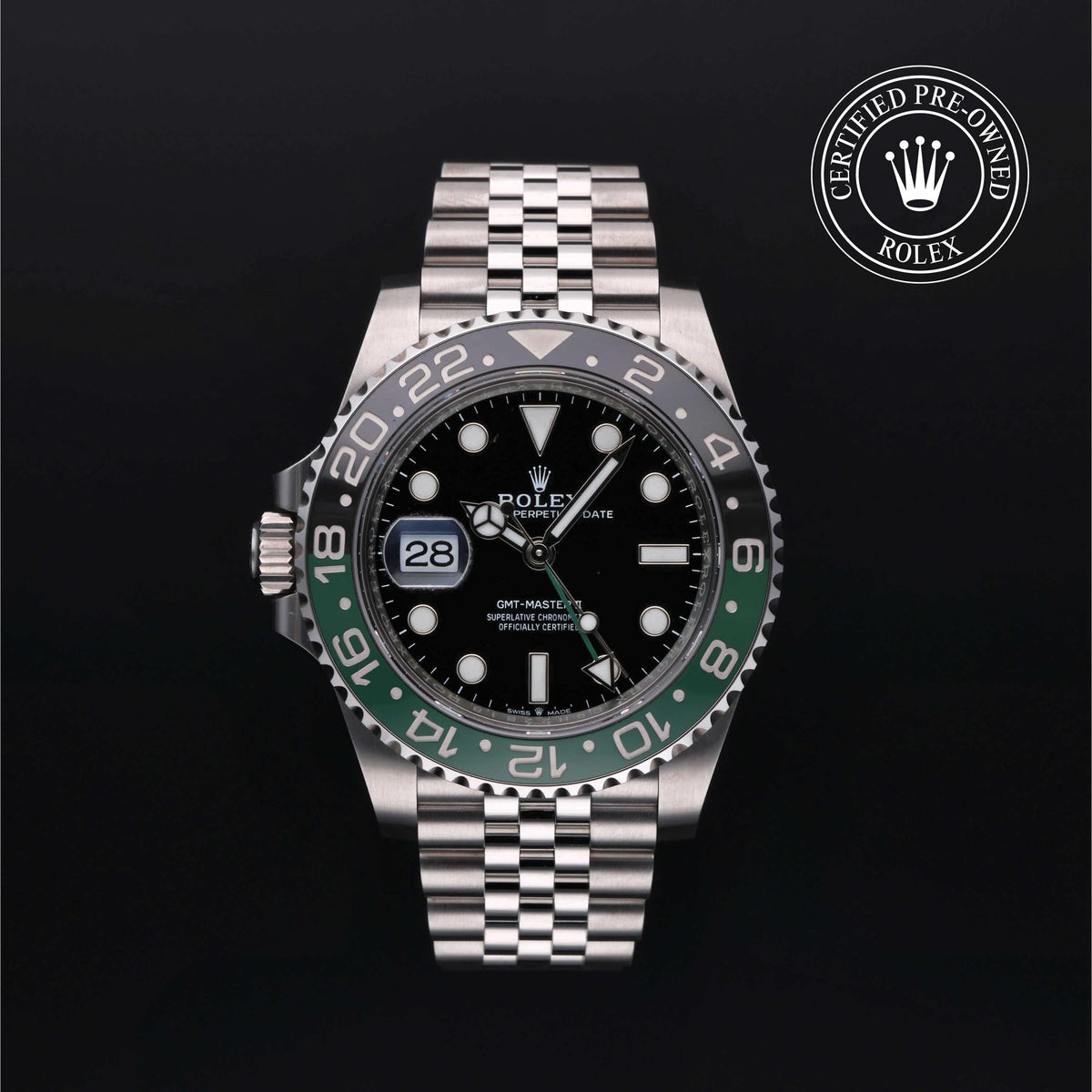 Rolex GMT-Master II luxury watch with black and green bezel, stainless steel bracelet, and date display, offered by a family-owned jeweler with expert customer service.