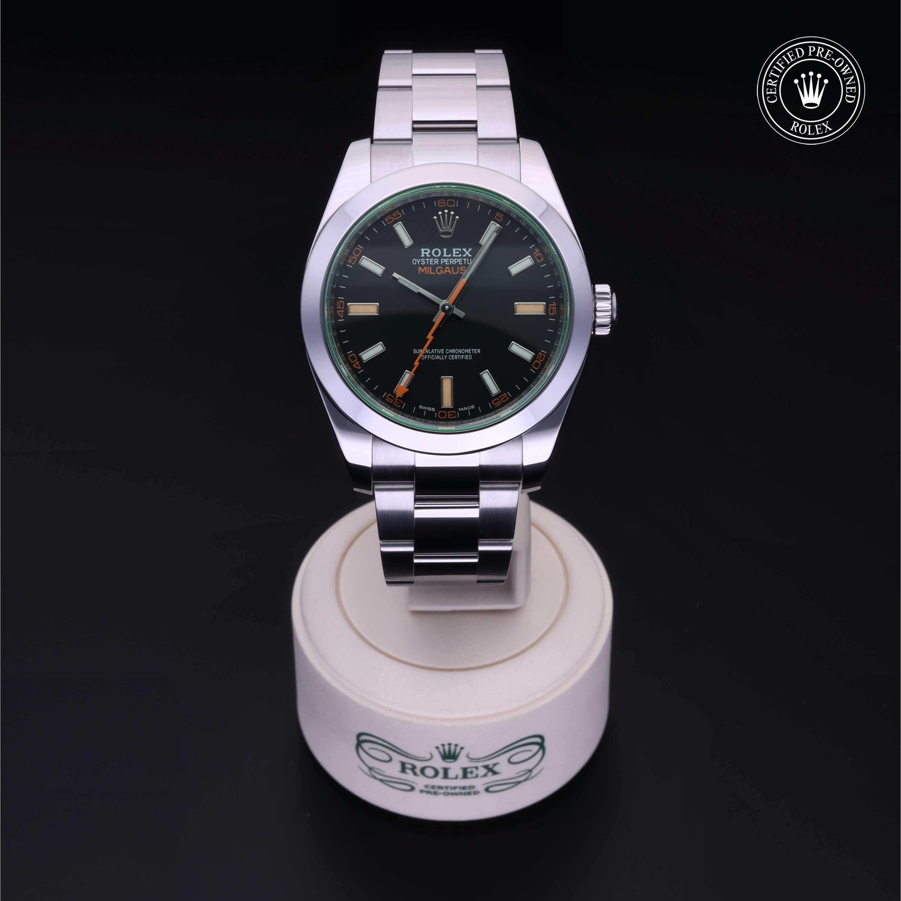Rolex Milgauss wristwatch with a black dial and stainless steel bracelet displayed on a branded stand, featuring a certified pre-owned Rolex logo in the corner.