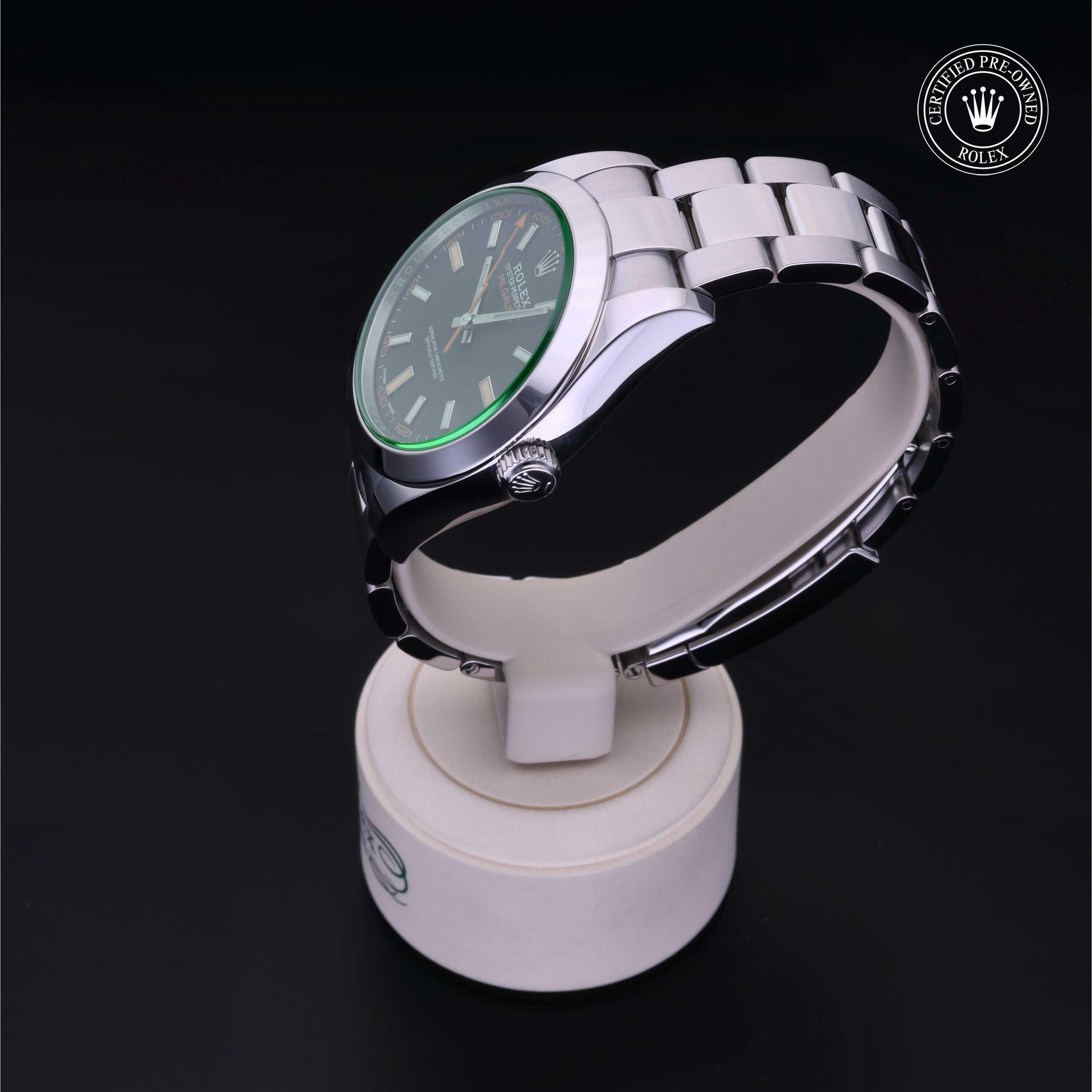 Rolex wristwatch with a silver metal band and black dial displayed on a white stand, featuring the Rolex Certified Pre-Owned logo, highlighting luxury and vintage appeal.