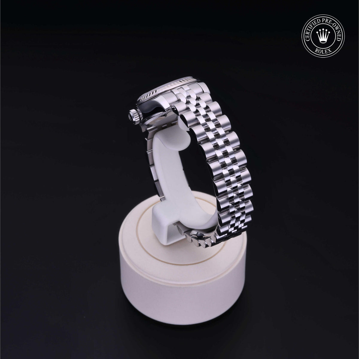 Silver Rolex watch band displayed on a white stand against a black background with a Rolex Certified Pre-Owned logo in the top right corner.