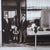 Black & White Photo of 2 Men and a Little Boy in Front of the Original Henne Storefront