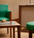 Green Chair and Wooden Coffee Table in Rolex Service Area