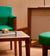 Green Chair and Wooden Coffee Table in Rolex Service Area