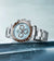 Rolex Cosmograph Daytona  M126506-0001 On its side on an ice blue table top