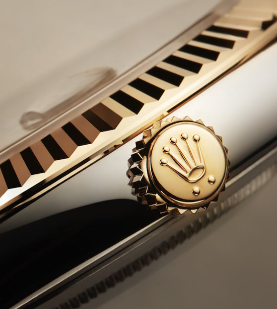 Close Up of Gold Rolex Crown on Watch
