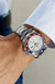 Close Up of Man's Wrist Wearing a Rolex GMT-Master II with Blue and Red Bezel, Meteorite Dial, and White Gold Band 