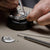 Hand of Watchmaker Using Tools to Precision Test Rolex Watch